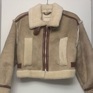 Women’s Tan and Cream faux fur short jacket, zipper, buckle details.Size S. Fun!